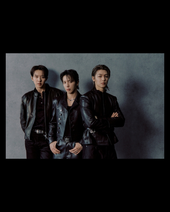 CNBLUE group concept photo for '3LOGY' album, featuring a festival-like theme.