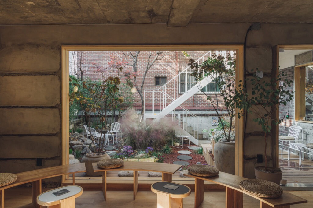 Warm and inviting wooden interior of Rofspace Yeonnam cafe, perfect for a rainy day.