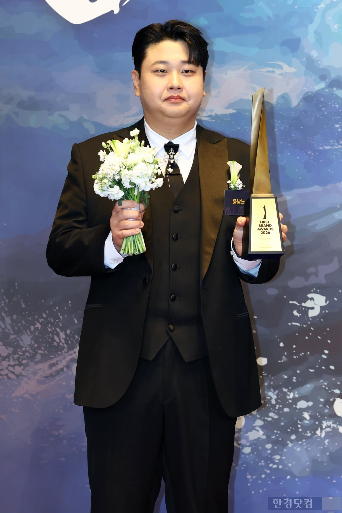 Close-up of Yoon Nam-no's brooch and suit details