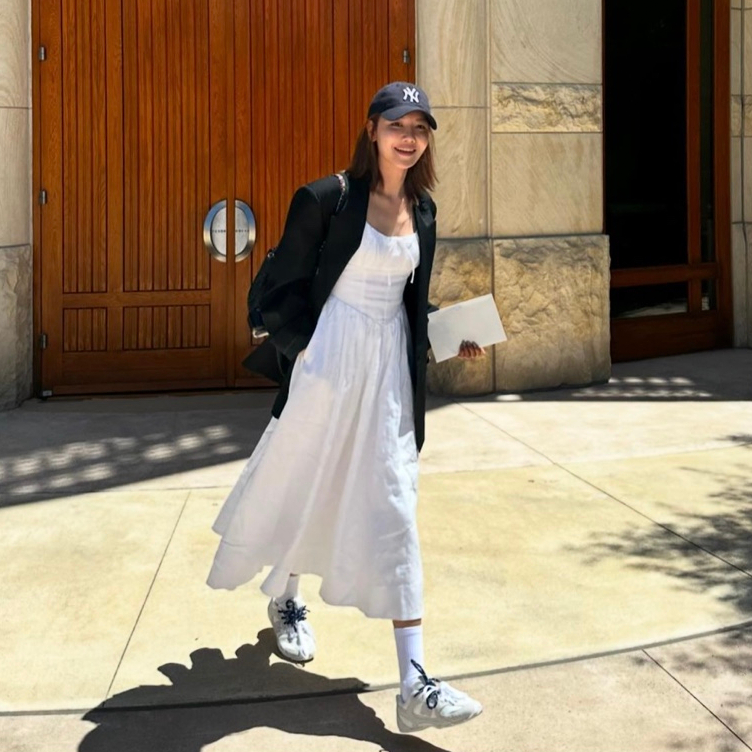 Sooyoung demonstrating the versatility of the sneakers with different outfits.