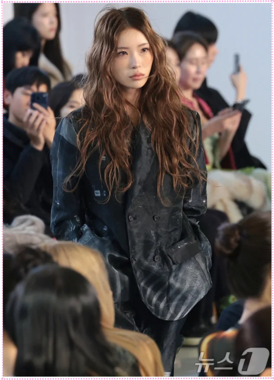 Close-up shot of Choi Jun-hee's face on the runway, highlighting her resemblance to her mother.