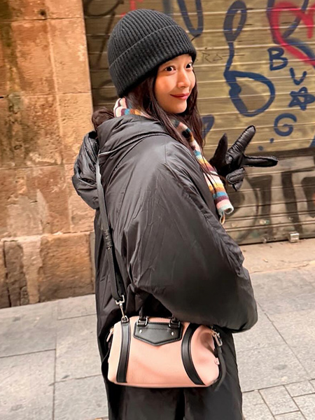 Shin Min-a layering a black coat with the pink Louis Vuitton bag