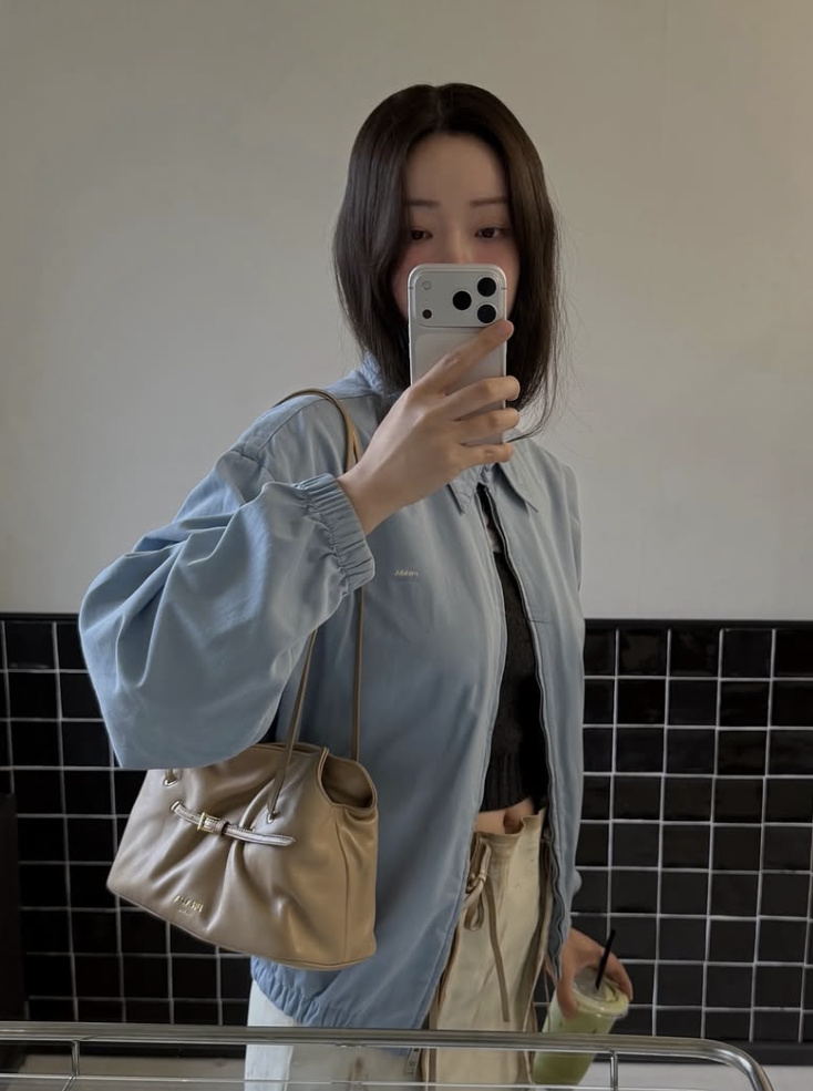 Cha Jung-won showcasing a minimalist look with a timeless handbag.