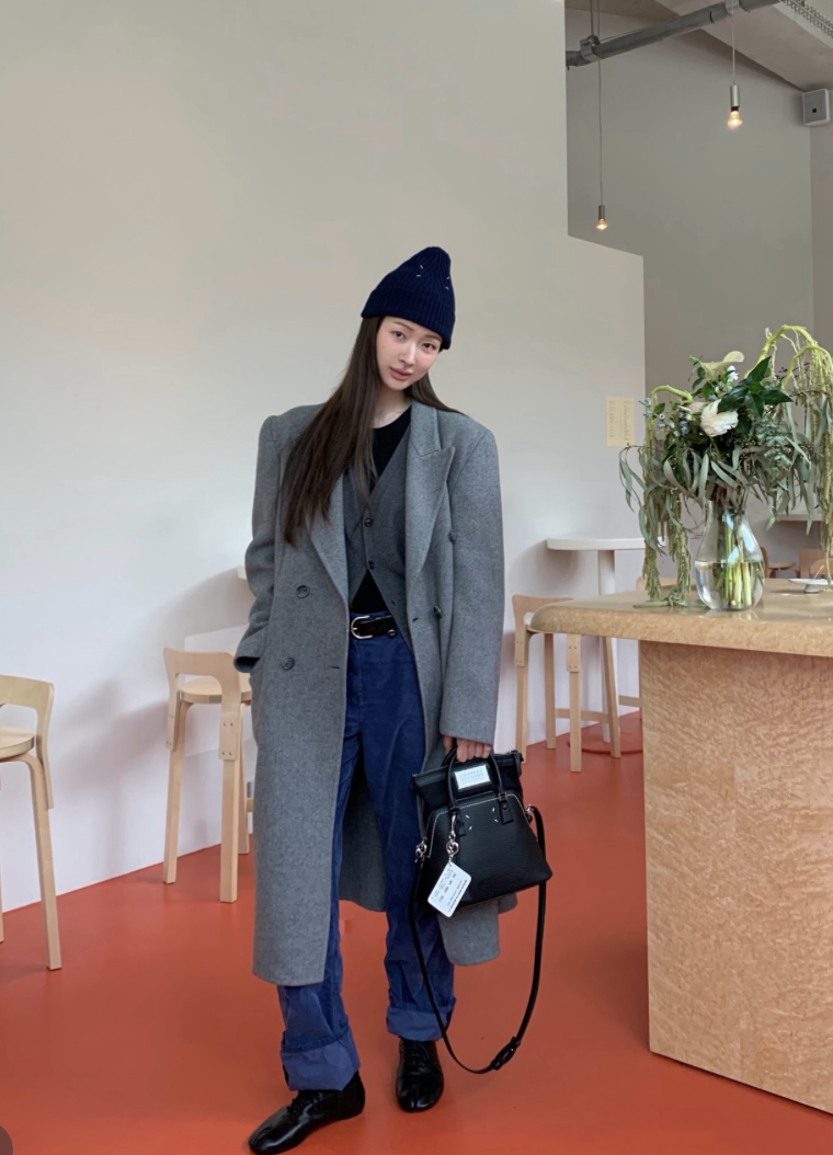 The Chanel Small Chain Clutch in black lambskin, highlighting its classic design.