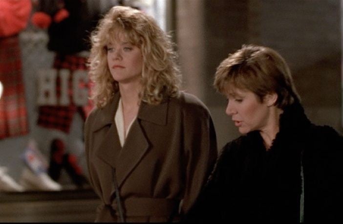 A minimalist ensemble featuring an oversized shirt and trousers, demonstrating controlled volume.