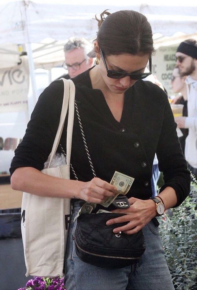 A striking flat lay showcasing the design details of the Chanel Gabrielle Backpack.