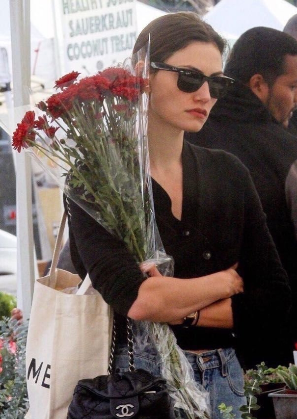 A street style photograph capturing the timeless appeal of a discontinued Chanel bag.