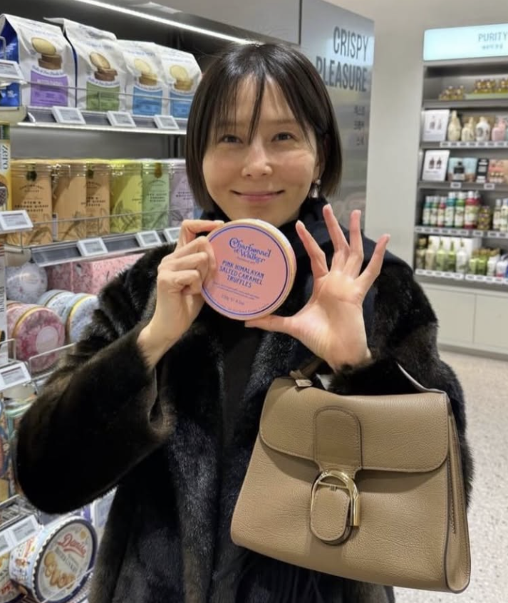 Close-up of the Delvaux Brillant Tempo S, highlighting its intricate buckle detail.