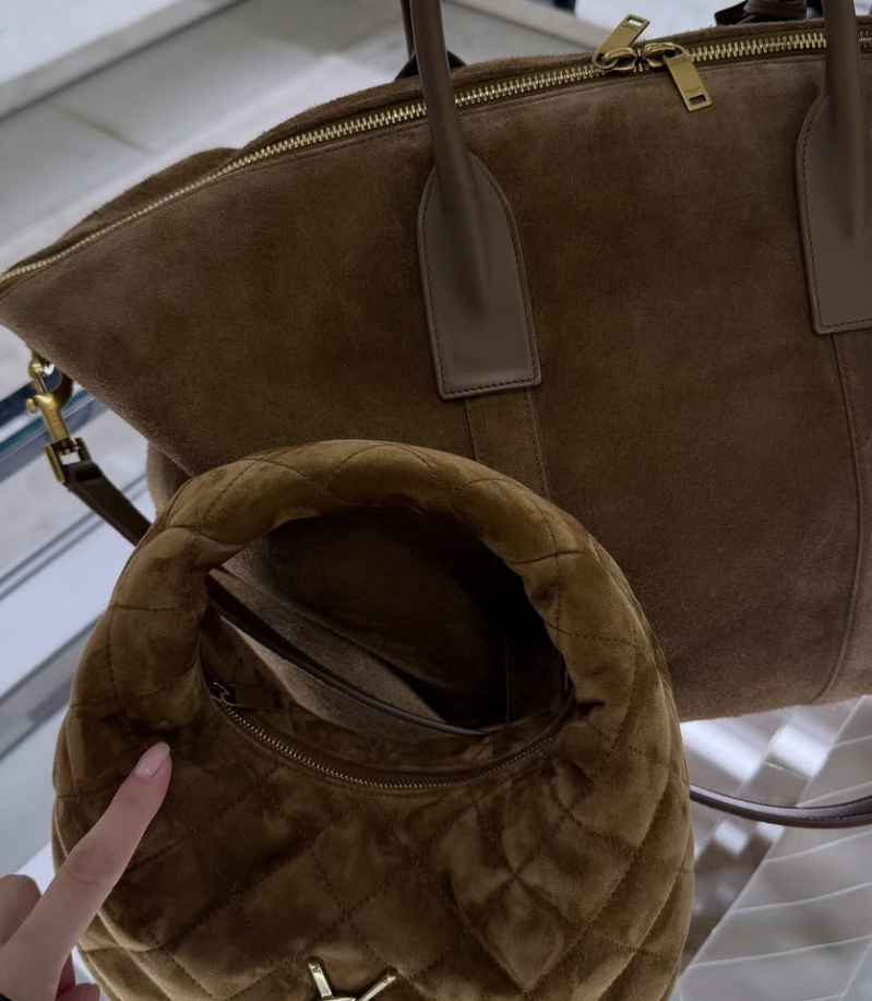 Lifestyle image of Lee Chung-ah carrying the Saint Laurent mini bag by hand.