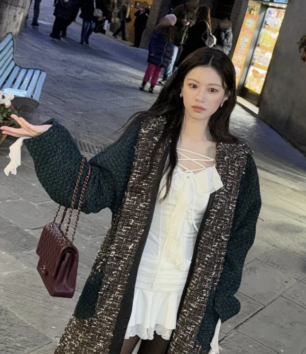 A detail shot of the Chanel 11.12 bag, emphasizing the craftsmanship of the quilting and the gold-tone hardware.